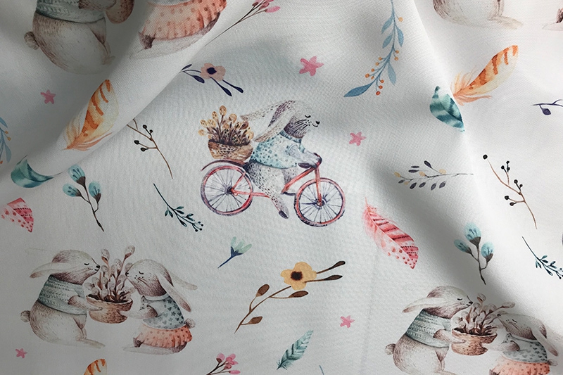Портьерная ткань Barbara с зайчатами на велосипедах